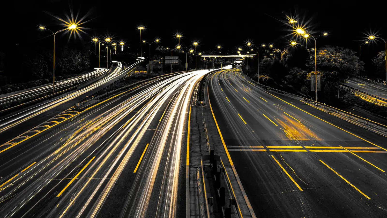 Light trails from cars on a motorway at night